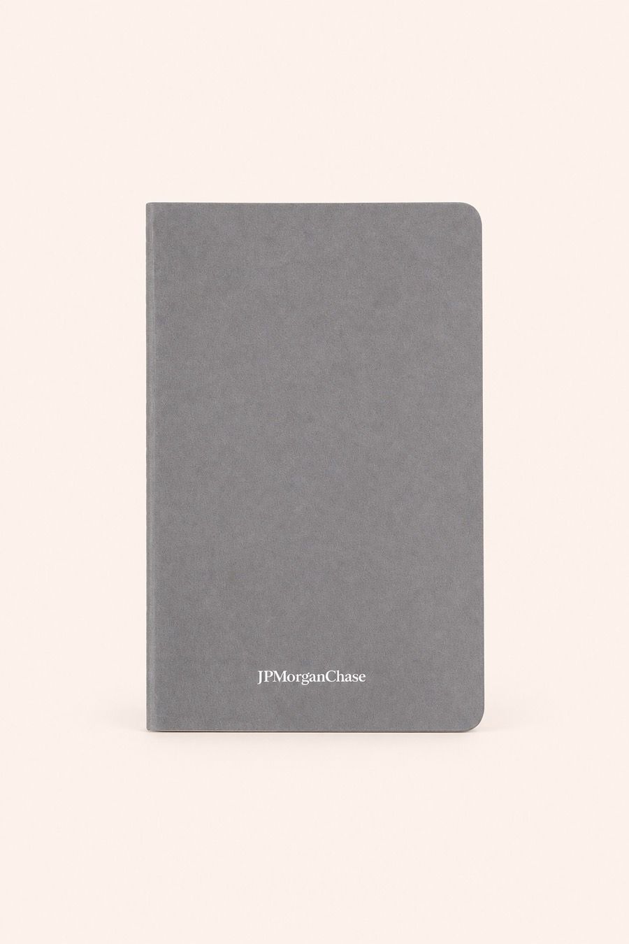 The same journal in pebble grey, with the same wordmark re-rendered in a darker ink so it stays legible.